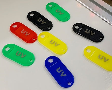 UV-marked colored tags