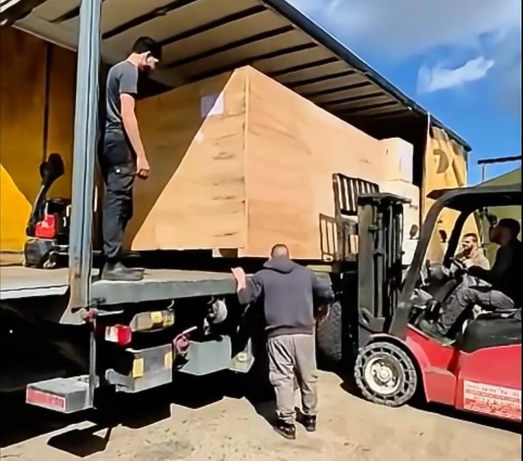 Customer unloading CNC router in Israel
